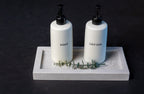 Third Coast Stone quartz bathroom tray organizer styled with soap and lotion dispensers